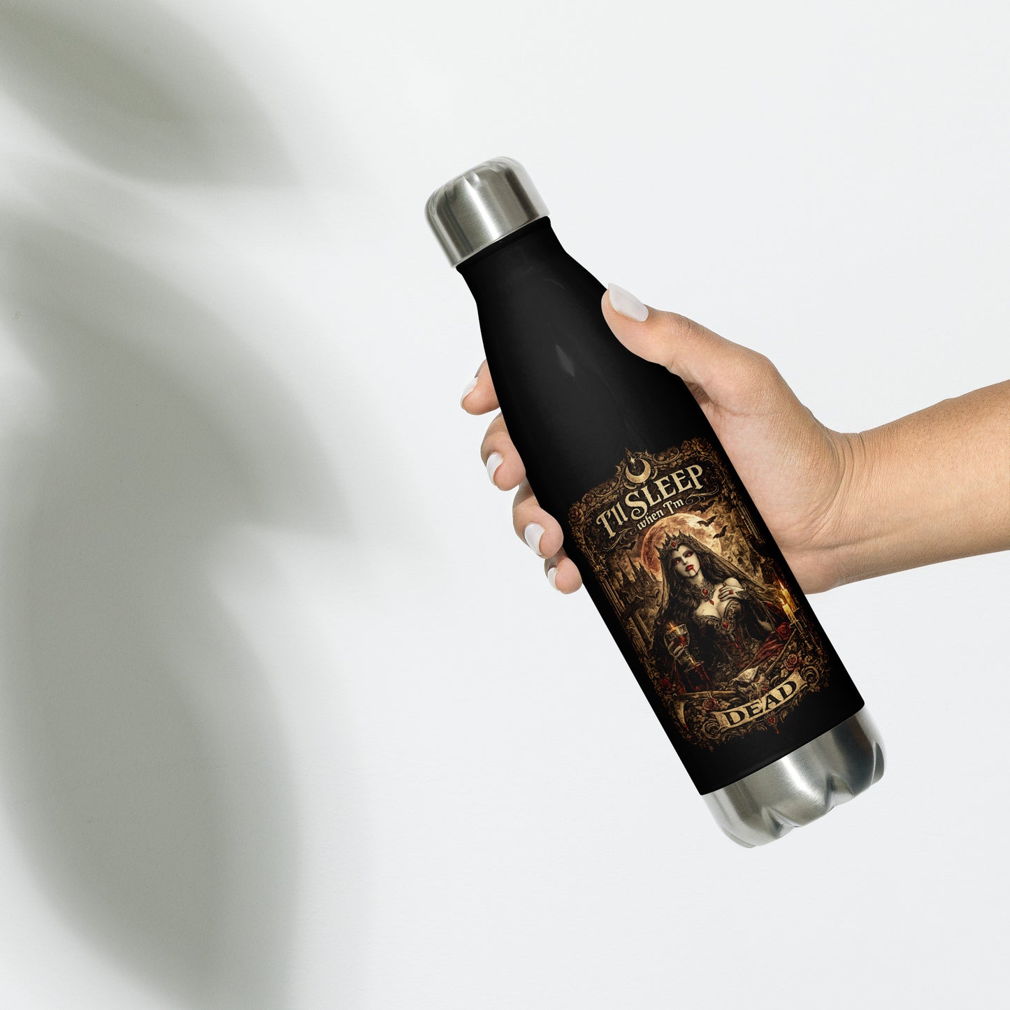 Victorian gothic vampire artwork featuring moonlit architecture, ravens, candles, roses, skulls, and the slogan "I'll Sleep When I'm Dead" displayed on a black stainless steel water bottle.